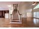 Spacious living room with hardwood floors, staircase, and ample natural light at 3117 Kings Arms Ne Ct, Atlanta, GA 30345