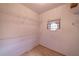 Compact walk-in closet with wire shelving and small window at 3117 Kings Arms Ne Ct, Atlanta, GA 30345