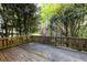 Wooden deck surrounded by lush greenery and trees at 3117 Kings Arms Ne Ct, Atlanta, GA 30345