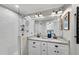 Updated bathroom with double vanity, granite counters, tiled shower, and modern fixtures at 1499 May Se Ave, Atlanta, GA 30316