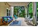 Charming back porch with furniture, grill, and view of the lush, green backyard at 2138 Jockey Hollow Nw Dr, Kennesaw, GA 30152