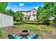 Expansive backyard with patio, fire pit, shed and two story home for relaxation and entertainment at 2138 Jockey Hollow Nw Dr, Kennesaw, GA 30152