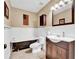Charming bathroom featuring a classic clawfoot tub and a dark wood vanity at 2138 Jockey Hollow Nw Dr, Kennesaw, GA 30152