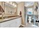 Bathroom with double sinks, granite countertops and decorative tile accents at 2138 Jockey Hollow Nw Dr, Kennesaw, GA 30152