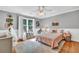 Bright bedroom with hardwood floors, large windows, and a soft neutral color scheme at 2138 Jockey Hollow Nw Dr, Kennesaw, GA 30152