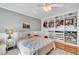 Bedroom featuring a well-organized closet, neutral tones and hardwood floors at 2138 Jockey Hollow Nw Dr, Kennesaw, GA 30152