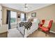 Bedroom with a comfy chair, light carpet, and bright light coming in from the windows at 2138 Jockey Hollow Nw Dr, Kennesaw, GA 30152