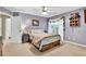 Cozy bedroom with a ceiling fan, neutral carpet and a window bringing in natural light at 2138 Jockey Hollow Nw Dr, Kennesaw, GA 30152