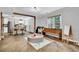Open-concept living space featuring a play area and a view into a bright modern kitchen at 2138 Jockey Hollow Nw Dr, Kennesaw, GA 30152