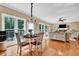 A living area with windows to the backyard, hardwood floors, and a chandelier at 2138 Jockey Hollow Nw Dr, Kennesaw, GA 30152
