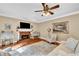 Comfortable living room with a fireplace, hardwood floors, and large windows for natural light at 2138 Jockey Hollow Nw Dr, Kennesaw, GA 30152