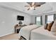 This main bedroom has an area for relaxing, a flatscreen TV and carpet at 2138 Jockey Hollow Nw Dr, Kennesaw, GA 30152