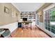 Home office with hardwood floors, built-in bookshelves, and natural light at 2138 Jockey Hollow Nw Dr, Kennesaw, GA 30152