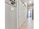 Hallway featuring tile floors, a closet, and a glimpse into an adjoining room at 5090 Eubanks Rd, Woodstock, GA 30188