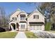 Charming two-story brick home with a well-manicured lawn and a two-car garage at 1300 Winfair Ne Ln, Brookhaven, GA 30329