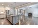 Open-concept kitchen with stainless steel appliances, granite countertops, and center island at 1300 Winfair Ne Ln, Brookhaven, GA 30329