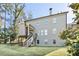 Back of house with stairs leading to a second story entrance and daylight basement at 1300 Winfair Ne Ln, Brookhaven, GA 30329