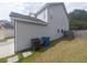 Side view of home's exterior showing backyard, lawn, and siding detail at 315 Dressage Ct, Riverdale, GA 30296