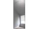 Bright bedroom featuring a large window with blinds and neutral walls at 315 Dressage Ct, Riverdale, GA 30296