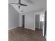 Spacious bedroom with neutral walls, wood-look floors, and vaulted ceilings at 315 Dressage Ct, Riverdale, GA 30296