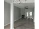 Open living area with modern floors, neutral paint, and a cozy fireplace feature at 315 Dressage Ct, Riverdale, GA 30296
