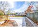A large concrete backyard patio featuring a small wooden deck area perfect for lounging or barbecuing at 263 Ohm Ave, Avondale Estates, GA 30002