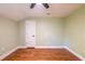 Bedroom featuring hardwood floors, green walls, white trim and a window at 263 Ohm Ave, Avondale Estates, GA 30002