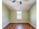 Empty bedroom with hardwood floors, green walls, ceiling fan and one window at 263 Ohm Ave, Avondale Estates, GA 30002