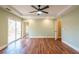 Spacious bedroom featuring hardwood floors, a sliding glass door, recessed lighting, and neutral paint at 263 Ohm Ave, Avondale Estates, GA 30002