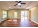 Bedroom with natural light, hardwood floors, recessed lighting, and a sliding glass door to a deck at 263 Ohm Ave, Avondale Estates, GA 30002