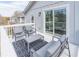 Deck includes patio furniture, a rug, a railing, and a sliding glass door leading inside the home at 263 Ohm Ave, Avondale Estates, GA 30002
