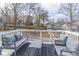 Large deck with patio furniture and a view of the trees and neighborhood at 263 Ohm Ave, Avondale Estates, GA 30002