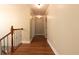 Long hallway with hardwood floors, neutral walls, and white trim at 263 Ohm Ave, Avondale Estates, GA 30002