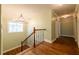 Well-lit hallway features a chandelier and hardwood floors, perfect for navigating the home at 263 Ohm Ave, Avondale Estates, GA 30002