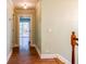 Hallway with hardwood floors leading to a bright room with a sliding glass door and natural light at 263 Ohm Ave, Avondale Estates, GA 30002
