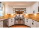 Well-equipped kitchen featuring stainless steel appliances, granite countertops, and white cabinets at 263 Ohm Ave, Avondale Estates, GA 30002