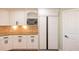 White cabinets, built-in microwave and refrigerator are just some of the features in this updated kitchen at 263 Ohm Ave, Avondale Estates, GA 30002