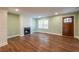 Cozy living room with a fireplace, hardwood floors, and a wooden door at 263 Ohm Ave, Avondale Estates, GA 30002