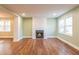 Bright living room featuring hardwood floors, a fireplace, and classic trim at 263 Ohm Ave, Avondale Estates, GA 30002