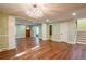 Open living room features hardwood floors, natural light, and modern chandelier at 263 Ohm Ave, Avondale Estates, GA 30002