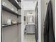 Bathroom view with vanity, vessel sink and storage shelves in hallway at 282 Oak Se Dr, Atlanta, GA 30354