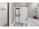 Bathroom with a laundry unit, a toilet, and neutral colored cabinets at 282 Oak Se Dr, Atlanta, GA 30354