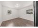 Bright bedroom featuring wood floors, two windows and fresh white paint at 282 Oak Se Dr, Atlanta, GA 30354