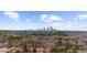An aerial view showing the city skyline in the distance with treetops below at 282 Oak Se Dr, Atlanta, GA 30354