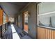 Covered front porch with a unique wooden facade, and stylish lighting at 282 Oak Se Dr, Atlanta, GA 30354