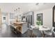 Eat-in kitchen with gray cabinets, granite countertops, stainless steel appliances, and modern pendant lighting at 282 Oak Se Dr, Atlanta, GA 30354
