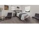 Bright main bedroom with accent chairs and a wooden bench at 282 Oak Se Dr, Atlanta, GA 30354