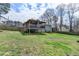 Expansive backyard with a covered deck, perfect for outdoor entertaining and relaxation at 639 Oak Moss Dr, Lawrenceville, GA 30043