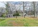 A large backyard space with mature trees at 639 Oak Moss Dr, Lawrenceville, GA 30043