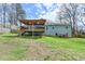 View of the backyard featuring a covered deck attached to the house at 639 Oak Moss Dr, Lawrenceville, GA 30043